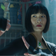 Meng'er Zhang's Xialing from Marvel's Shang-Chi wears a cropped haircut with bangs and stands ready to fight.
